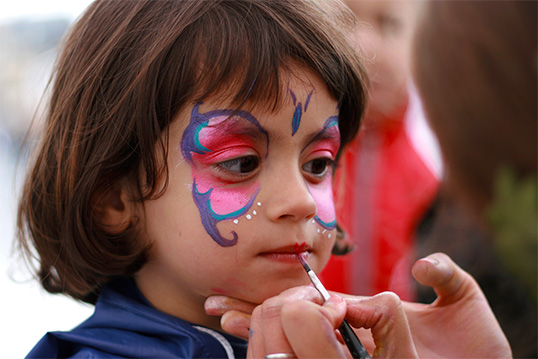 image of child with face paint enjoying springtime in the Bronx