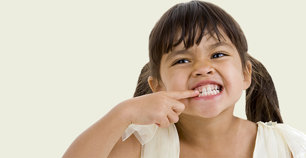 image of child smiling with teeth