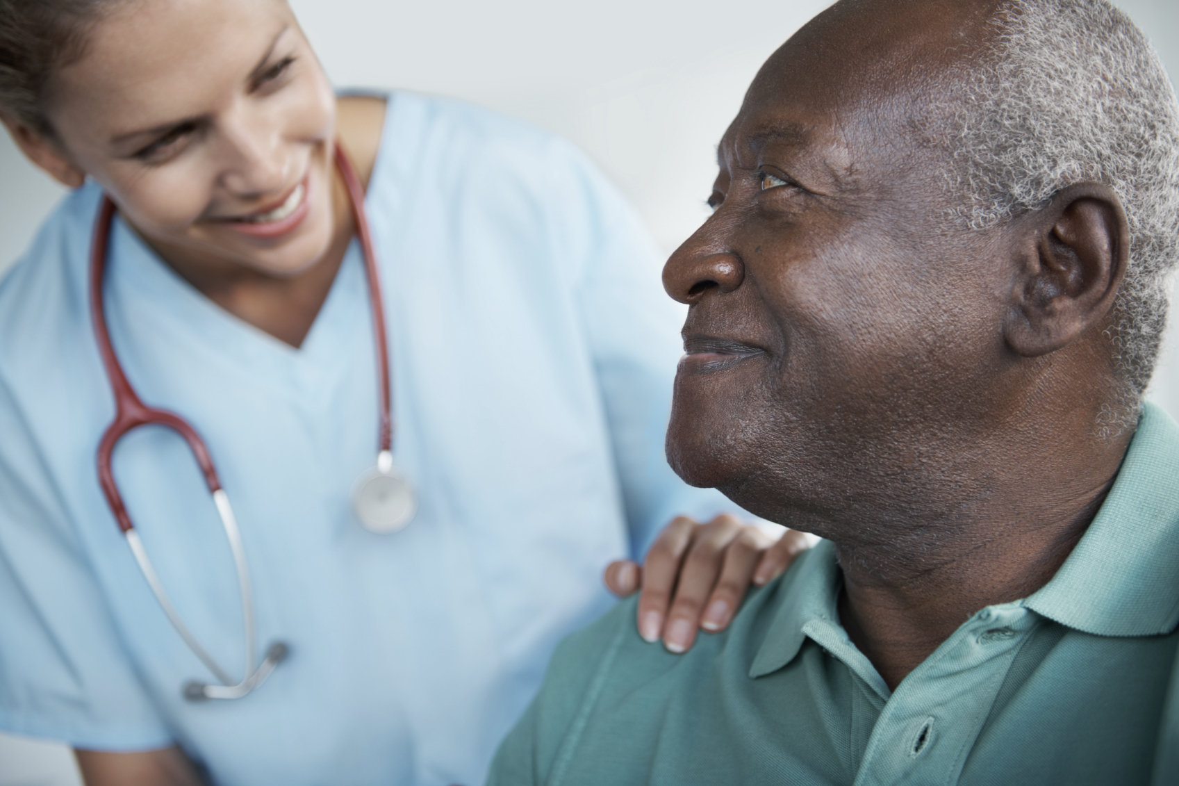 Image of a doctor talking to a patient to reduce hospital readmissions