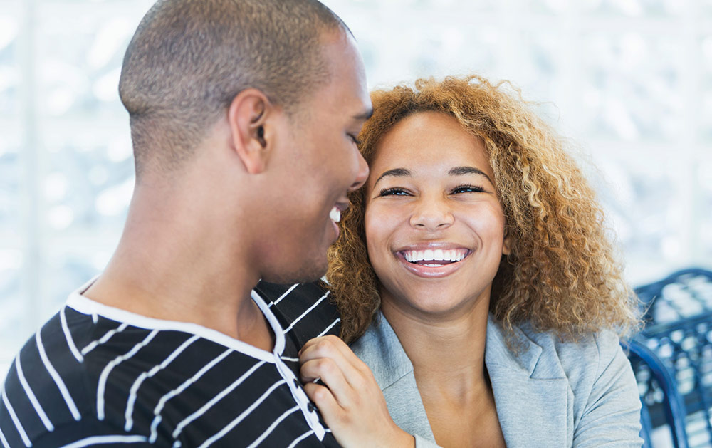 Image of couple smiling at each other