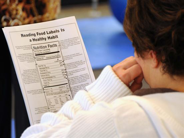 Image of person reading food nutrition facts