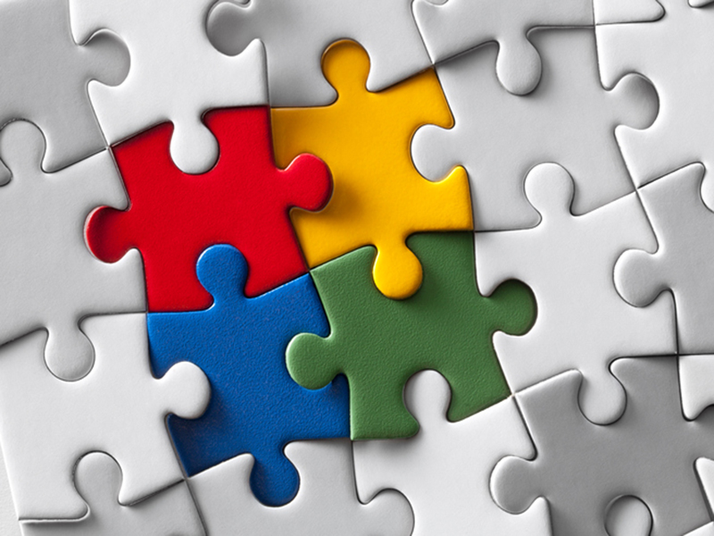 Image of puzzle pieces put together to represent the blend of mental health within primary care
