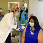 Image of Clover McLennon Receiving the Pfizer Covid-19 Vaccine.