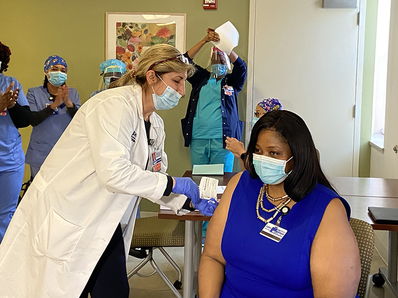 Image of Clover McLennon Receiving the Pfizer Covid-19 Vaccine.