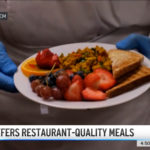 Close up of SBH head chef holding a plate of healthy food