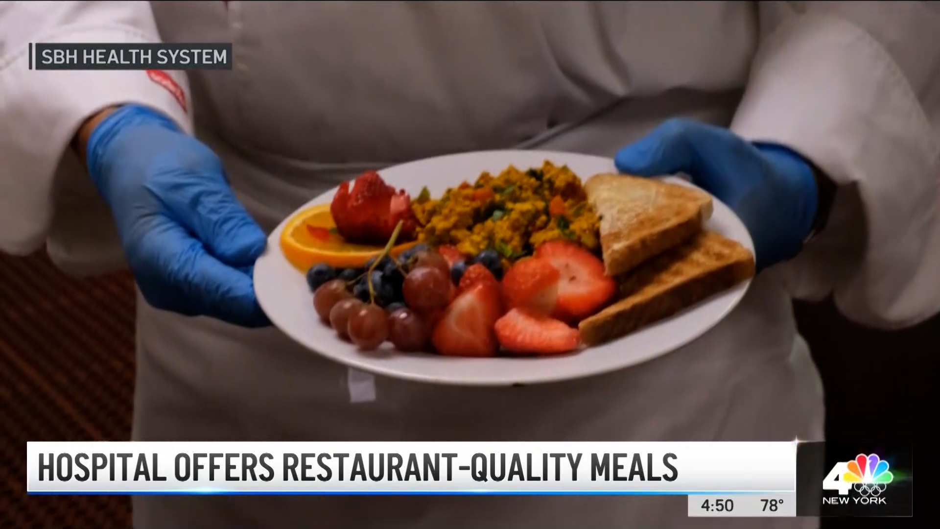Close up of SBH head chef holding a plate of healthy food